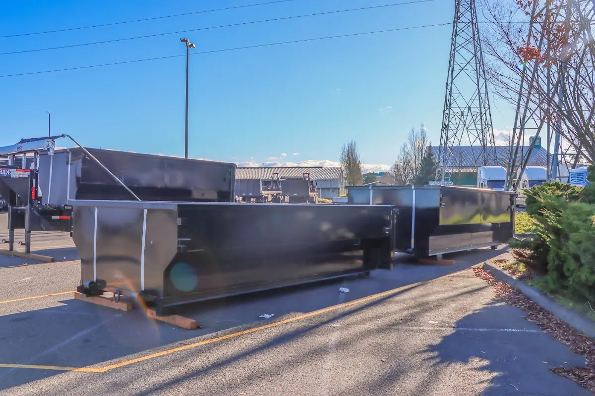 Roll-off dumpster ready for waste disposal at job site for Roofing Dumpster Rental in Winton